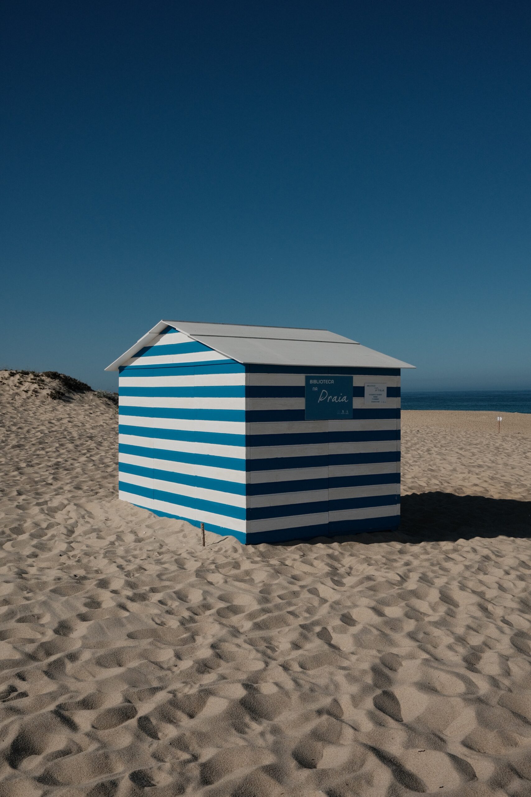 Biblioteca na Praia, the blue and white striped beach library in Melides