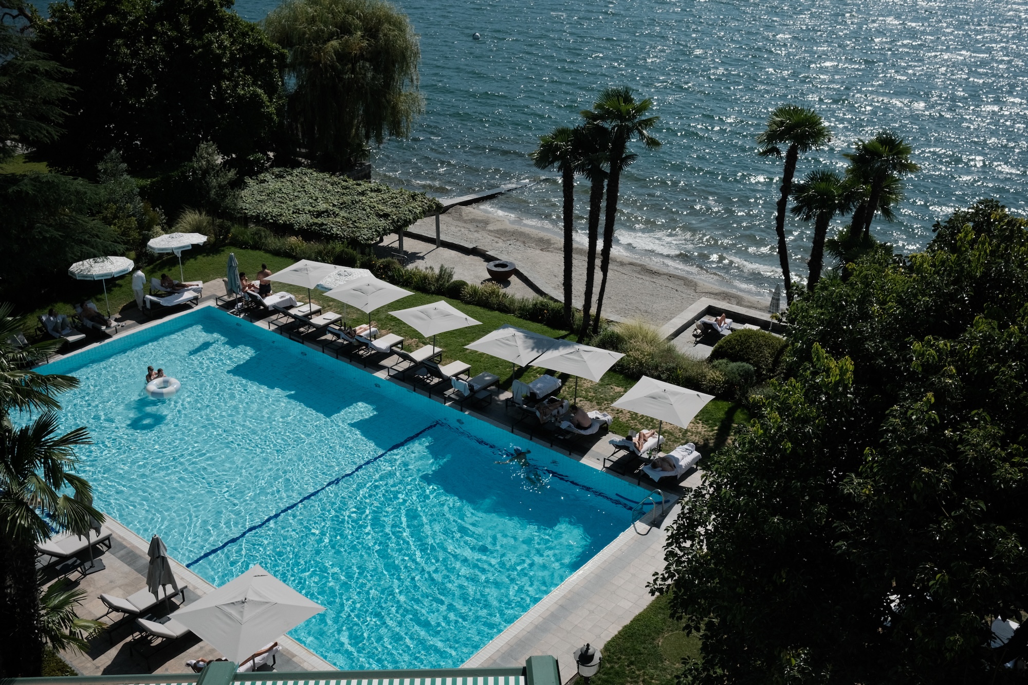 Aerial view of the pool, lawn and private beach at Hotel Eden Roc