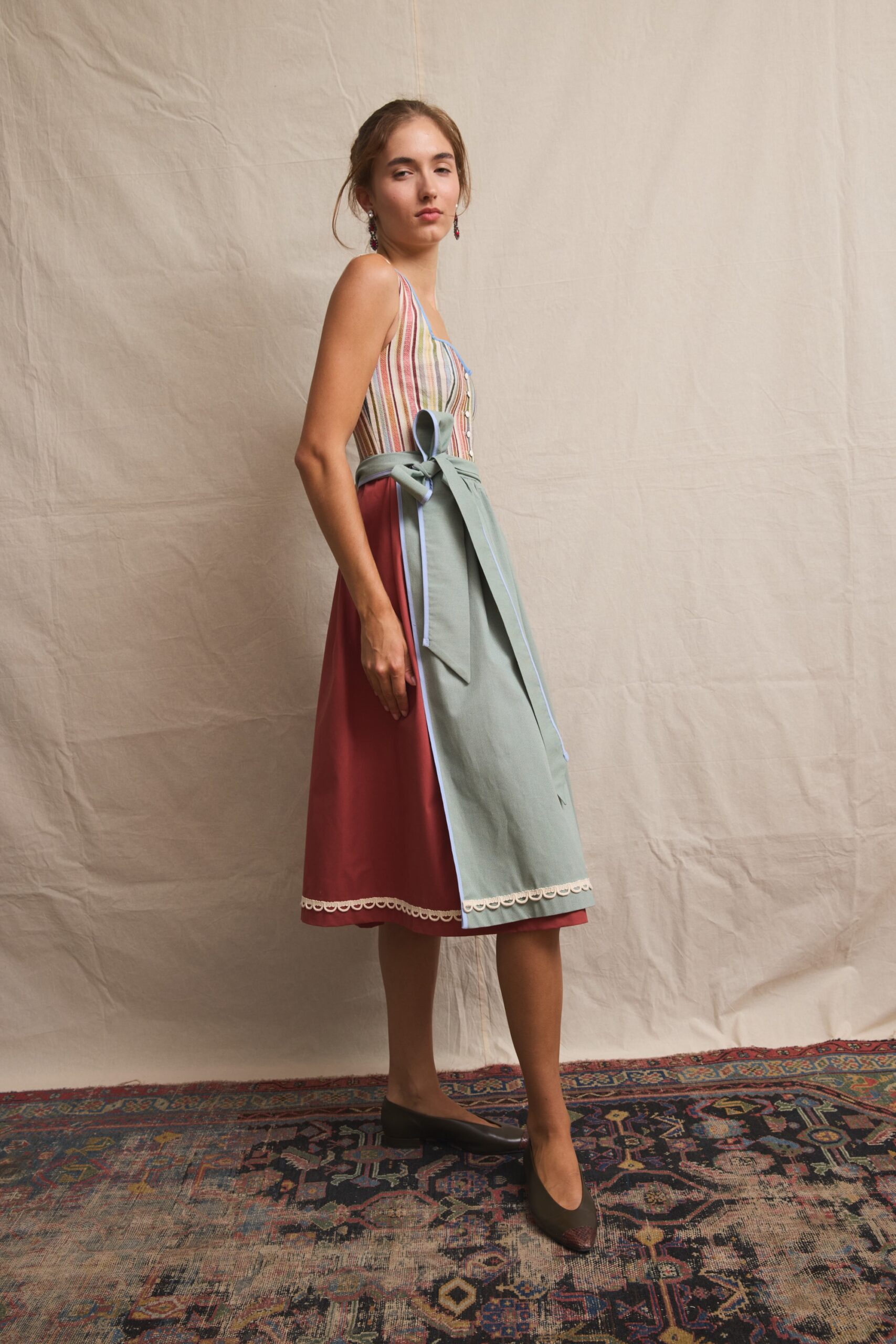 Dirndl Paula with striped bodice, terracotta skirt and sage apron with scalloped trim