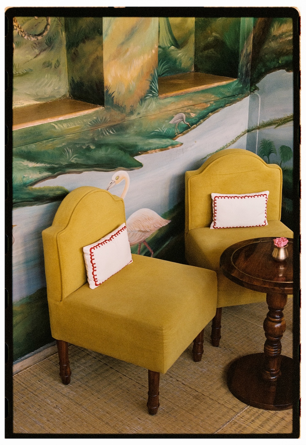Mustard yellow chairs in the upstairs bar at The Johri, Jaipur