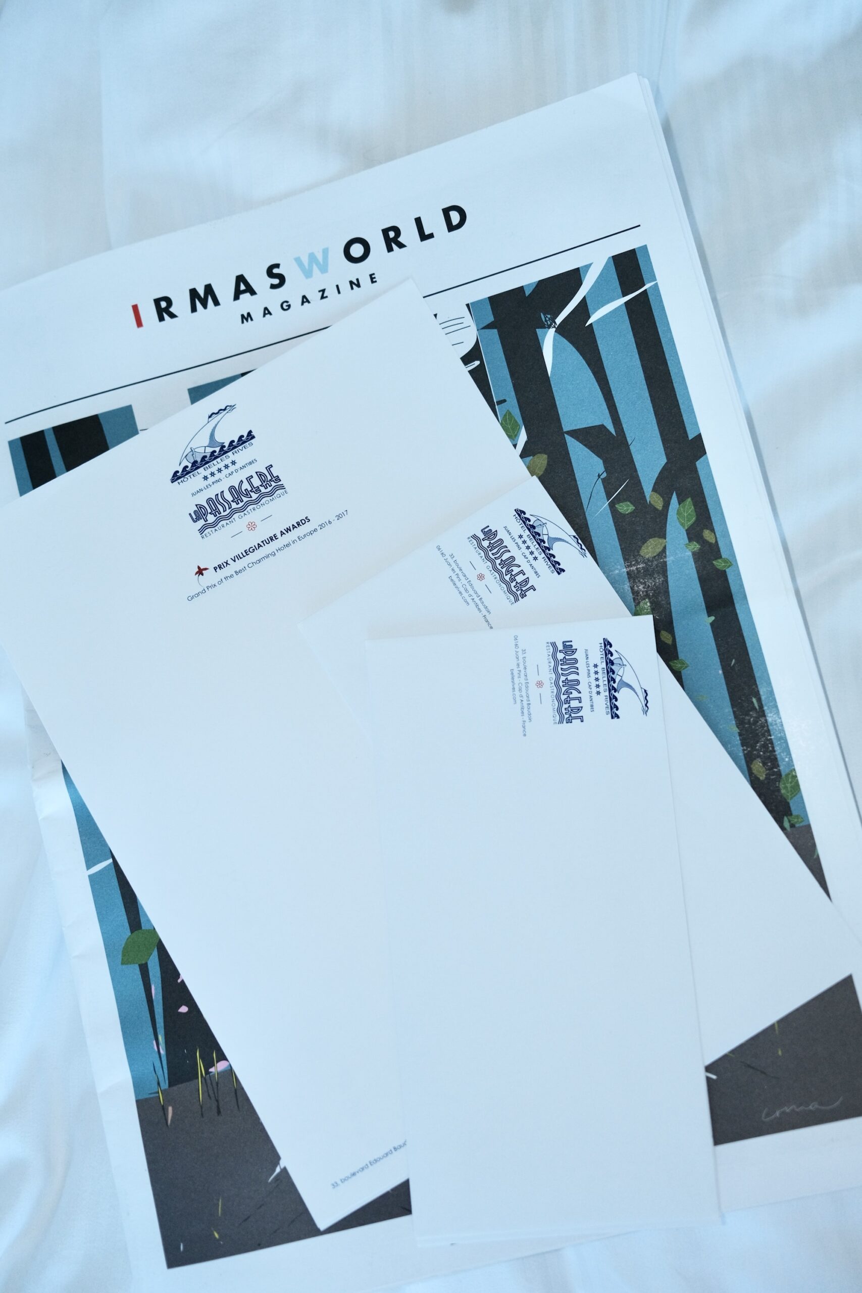 Hotel Belles Rives letterhead and envelopes on top of the IRMASWORLD Magazine