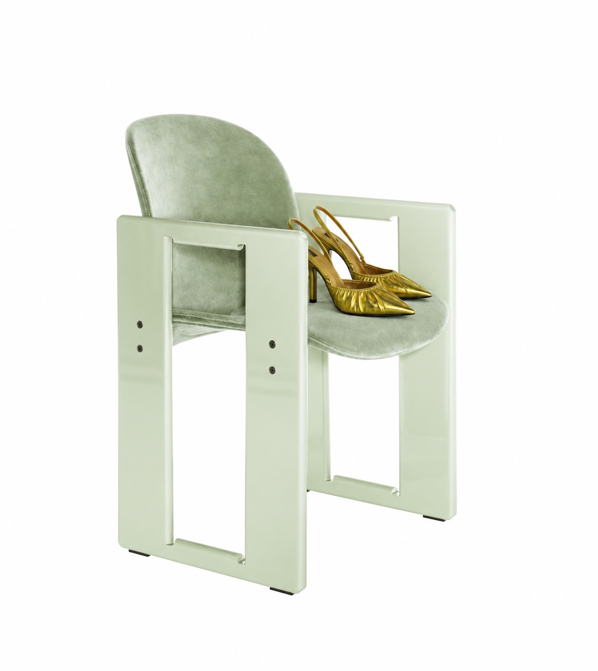 Gold slingback heels on a sage velvet armchair