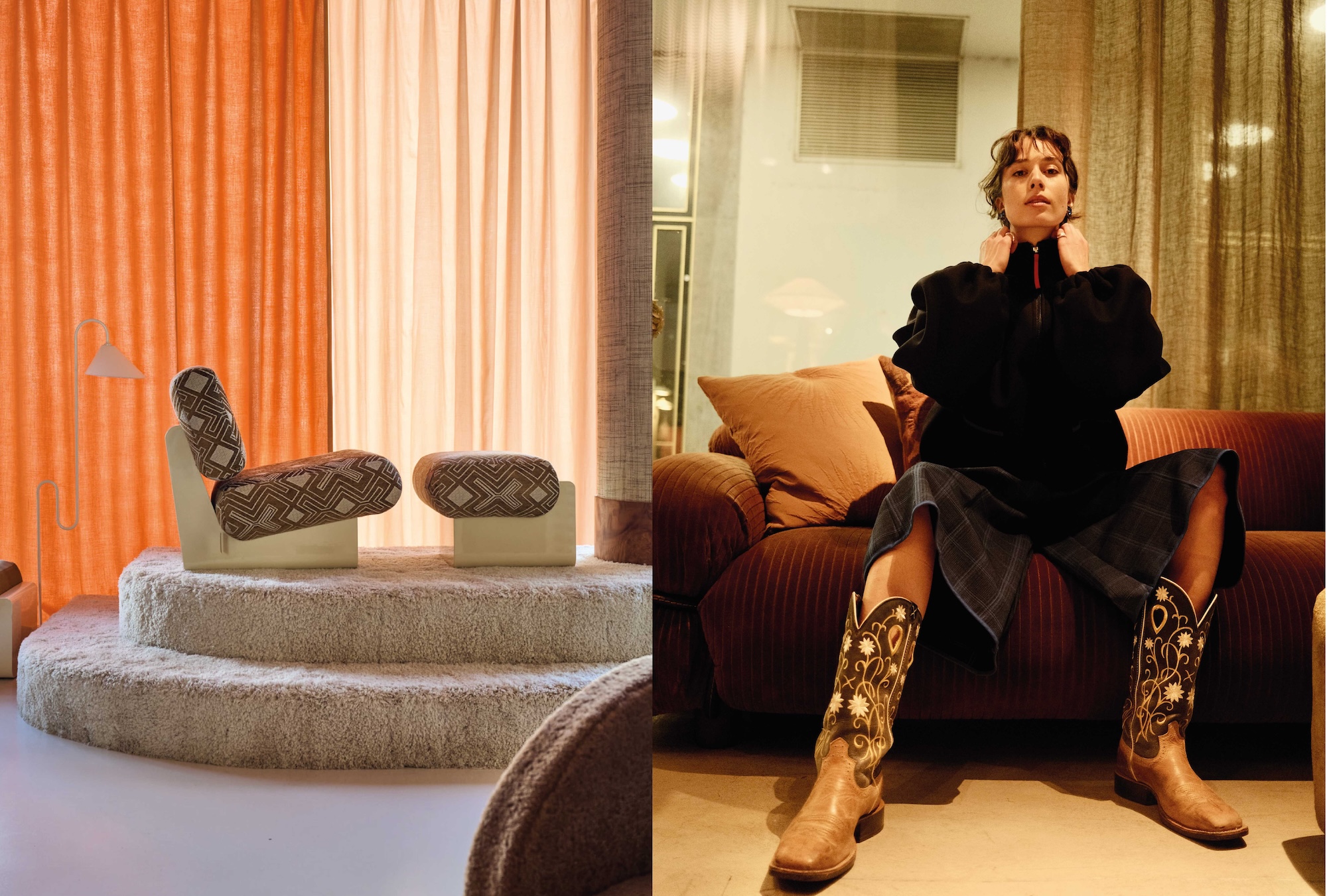 A lounge chair on a carpeted step in the showroom and a woman on a sofa in a black bomber jacket and cowboy boots