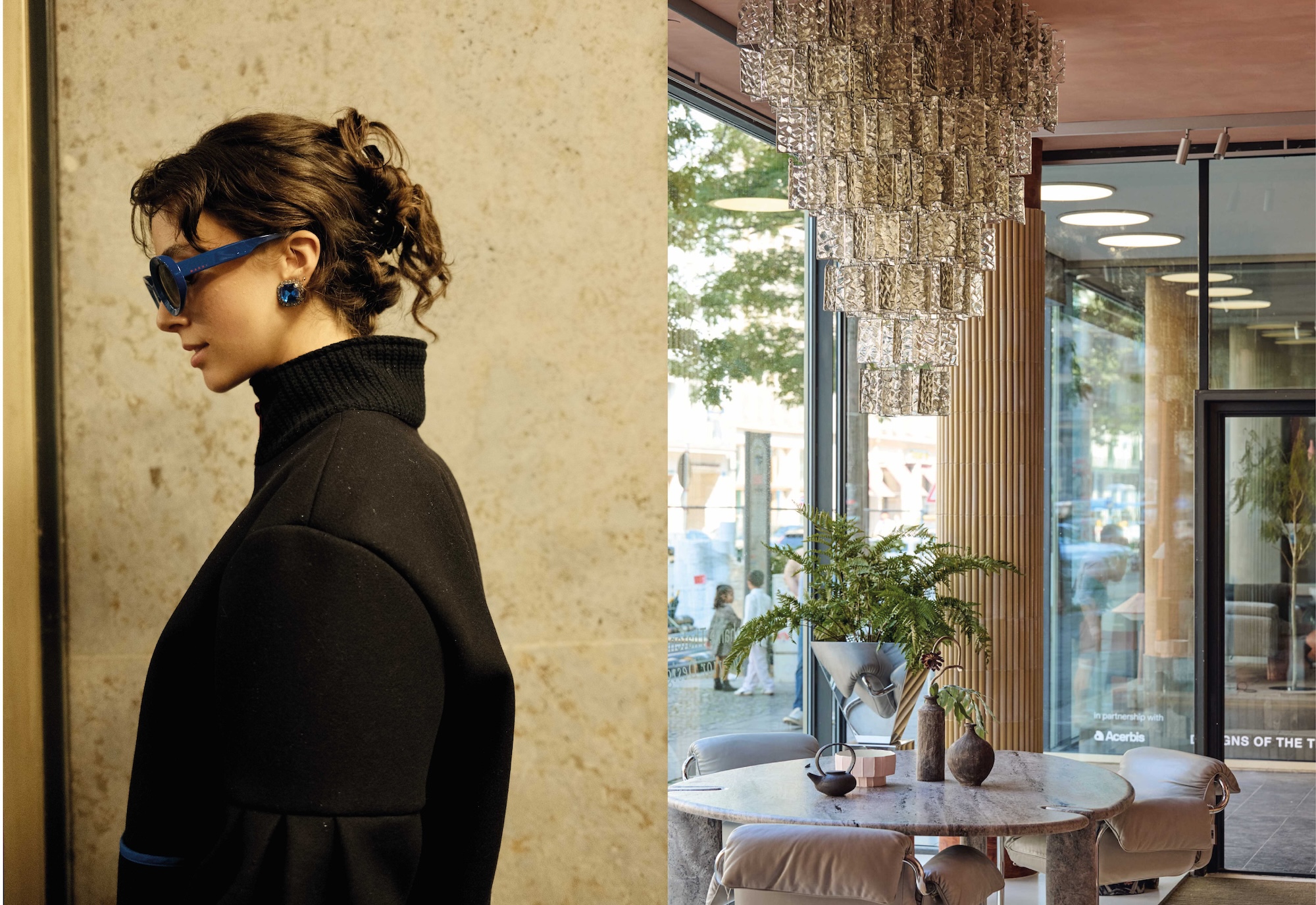 A woman in a black coat and blue sunglasses and the showroom entrance with a glass chandelier